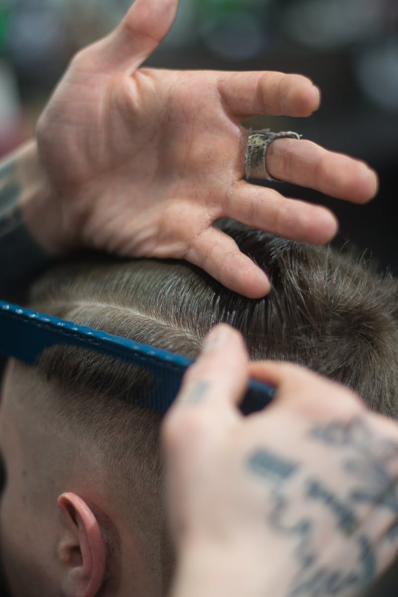 Person Combing Person's Hair